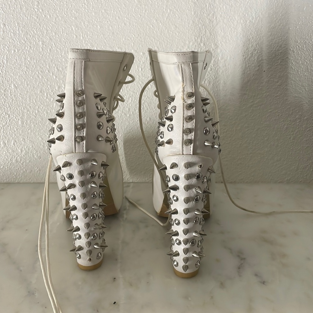 White spike platform boots